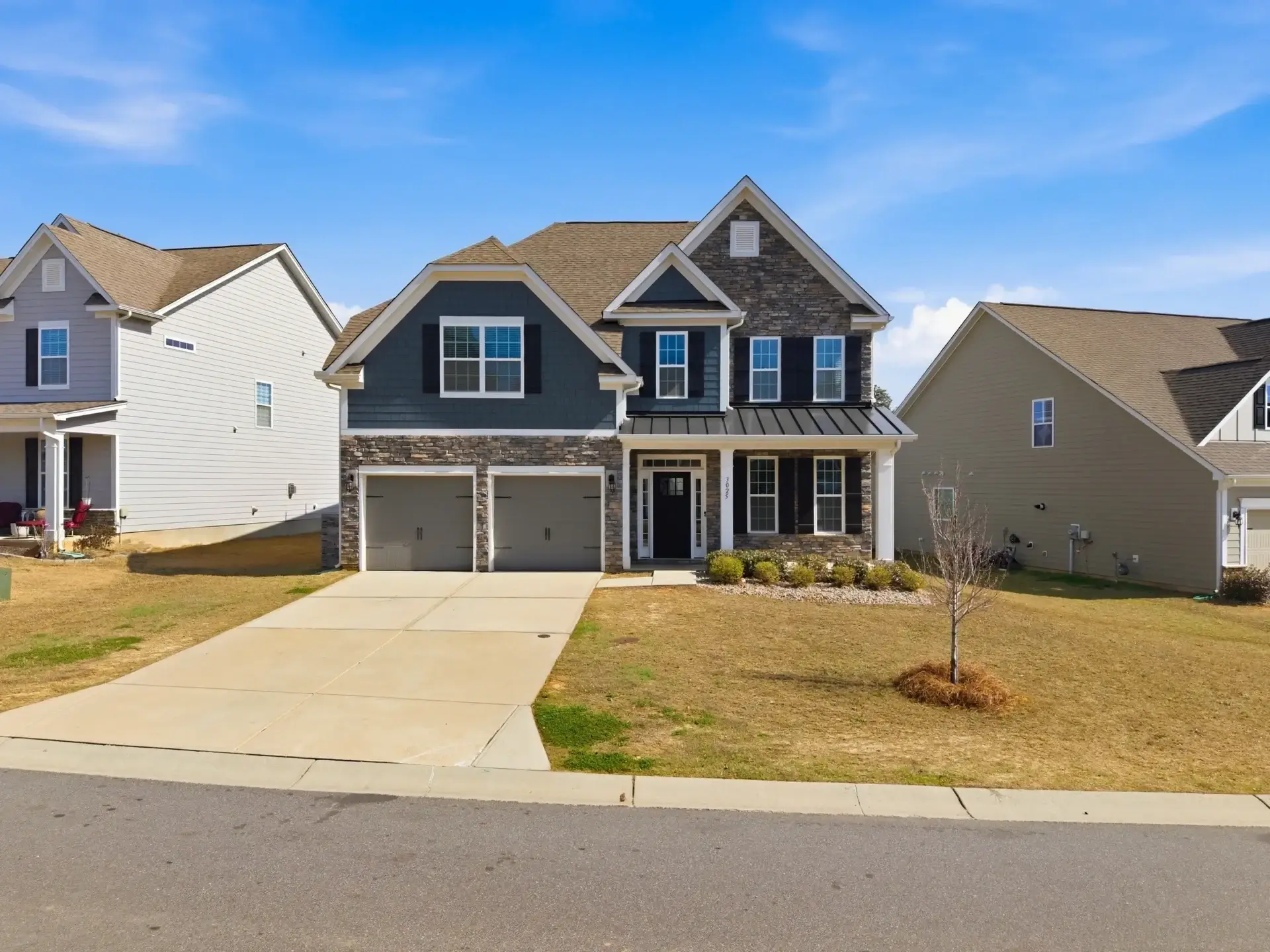 Two-story suburban house with double garage