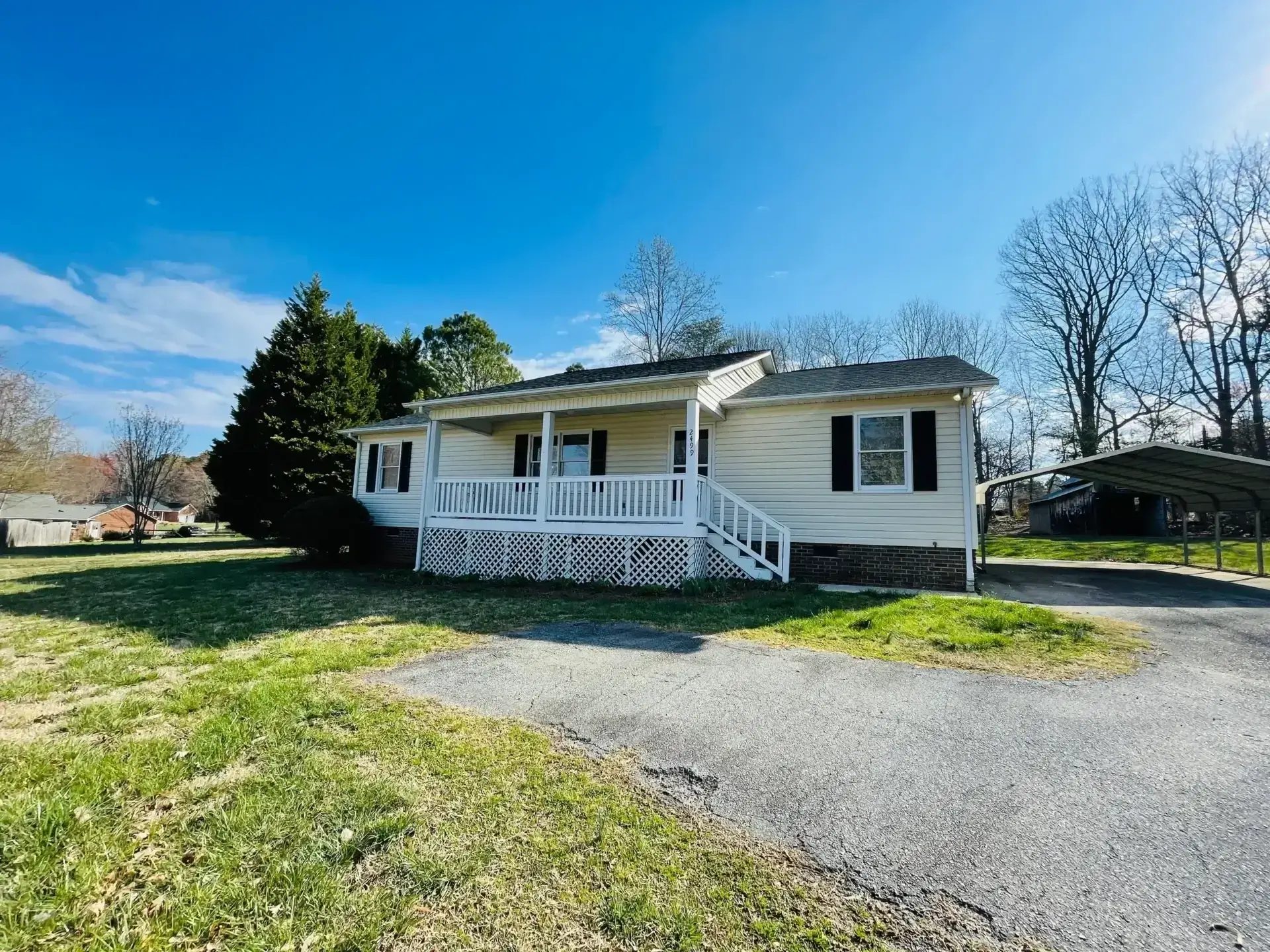 Single-story house with porch and carport