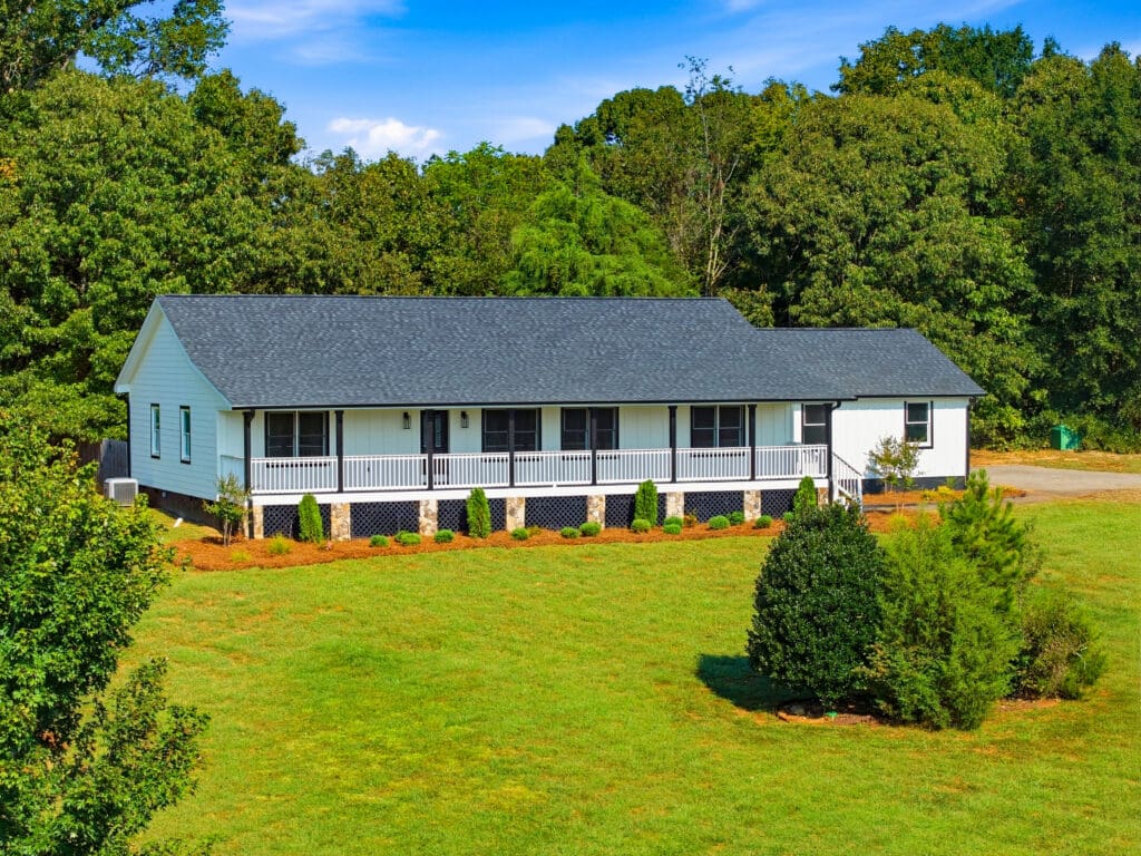 Single-level home with a spacious green yard.